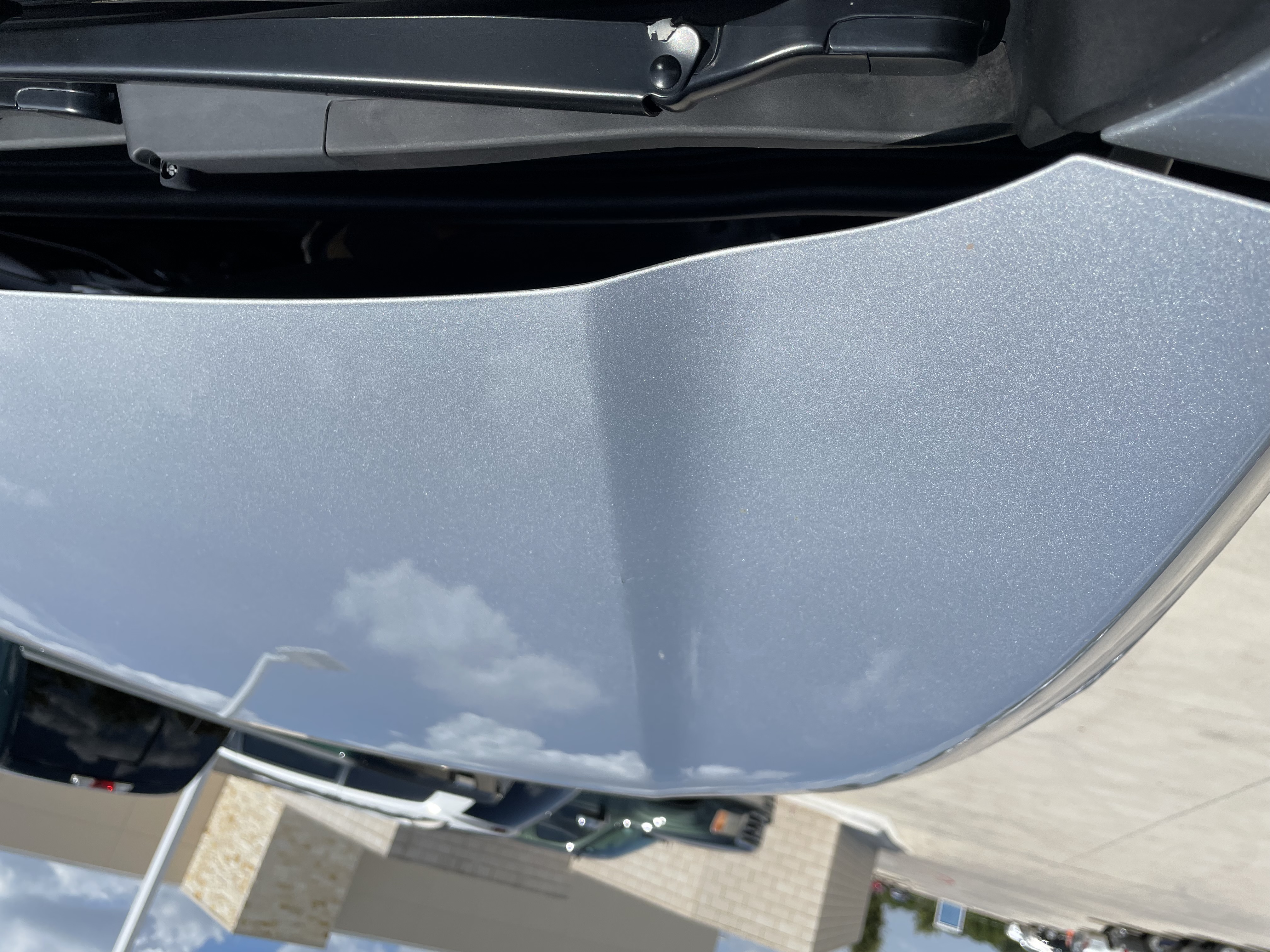 After PDR — silver sedan hood restored