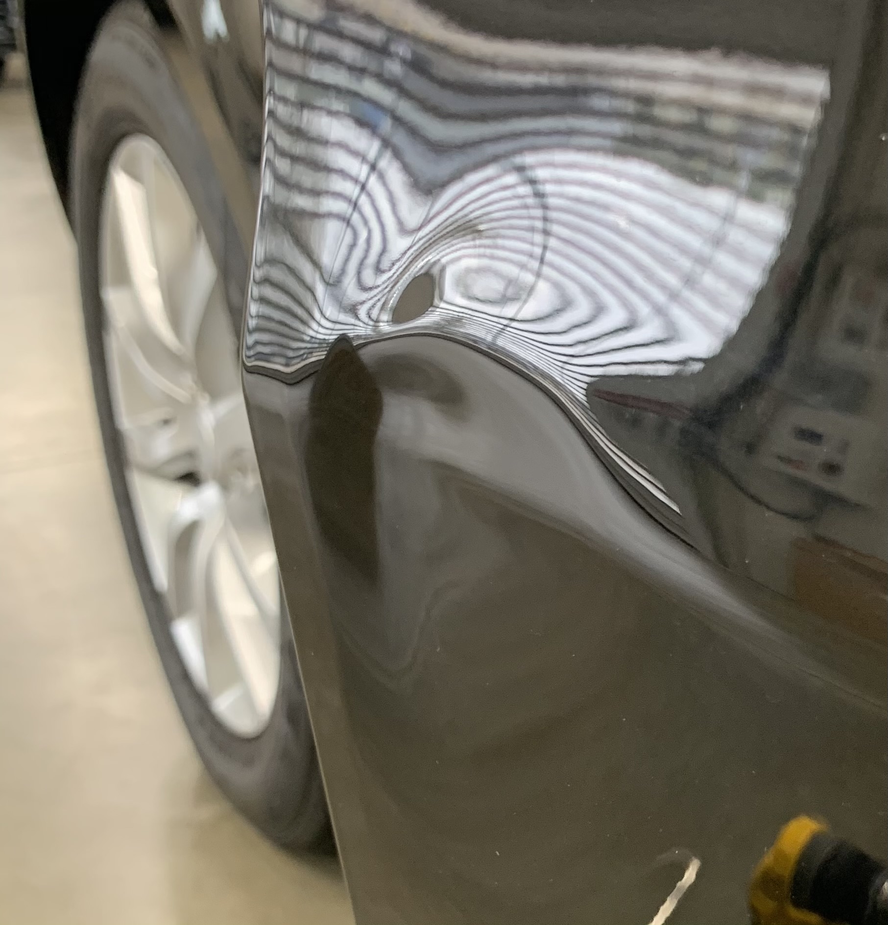 Before PDR — Range Rover door dent under reflection board