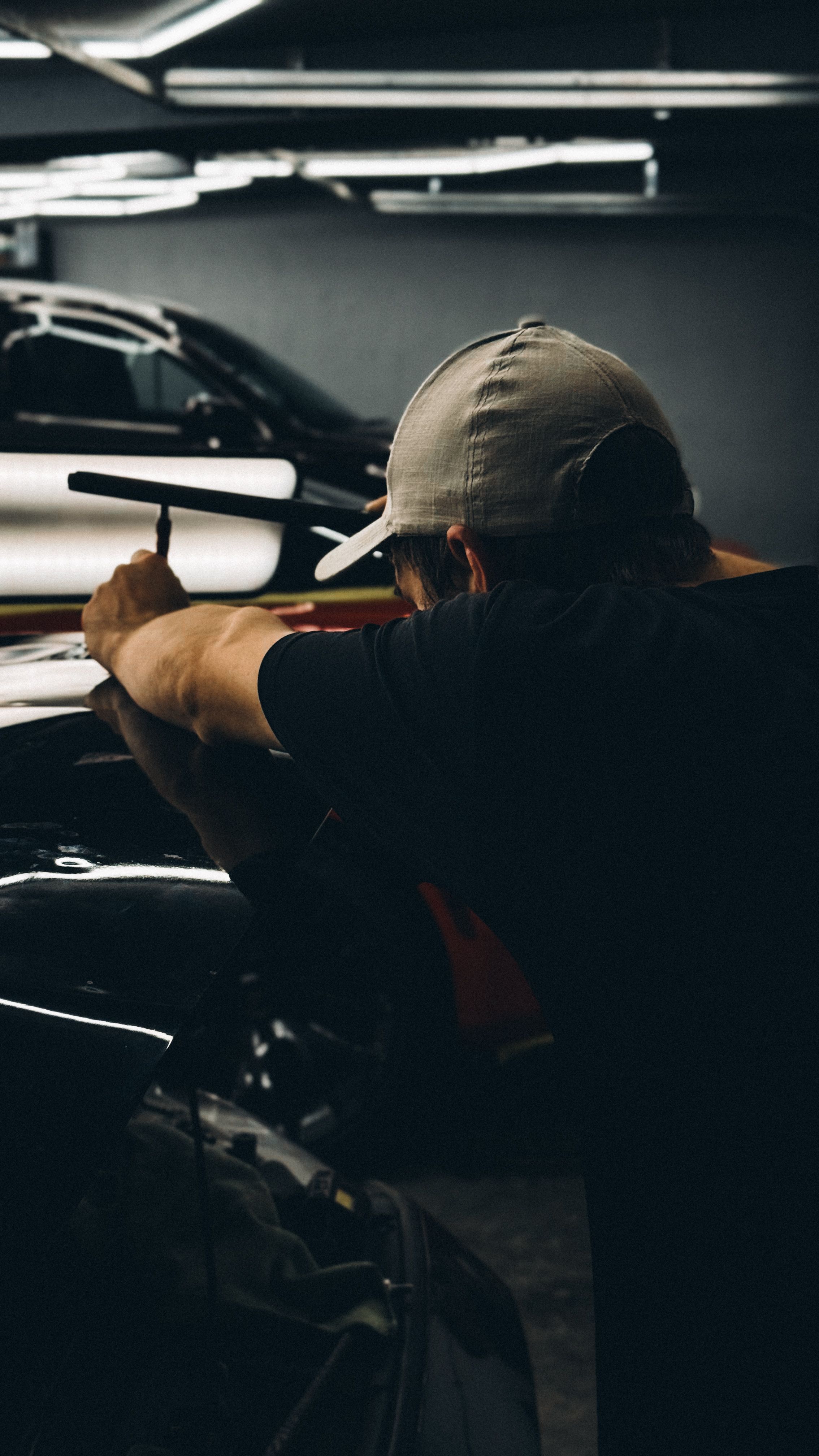 Paintless dent repair technician at work